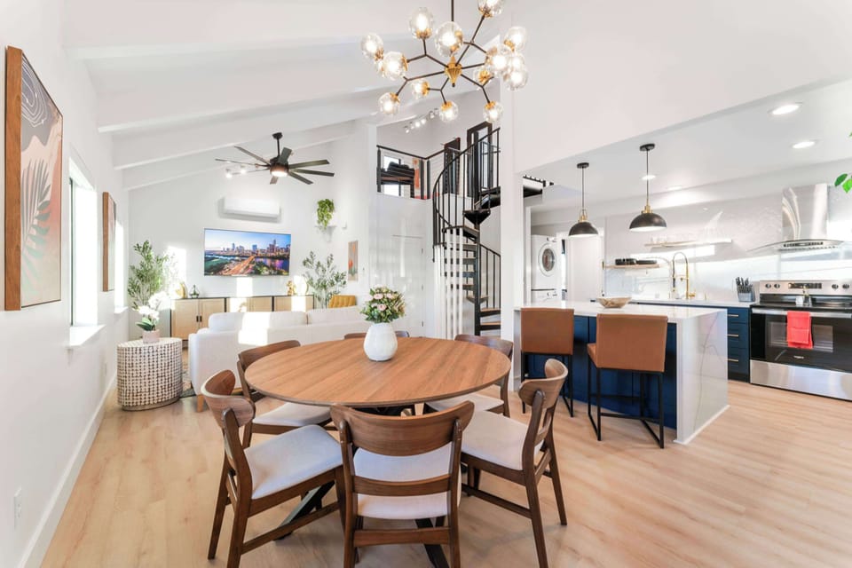 Dining area, with ample seating for 6 at the dining table and additional seating for 2 more at the kitchen island