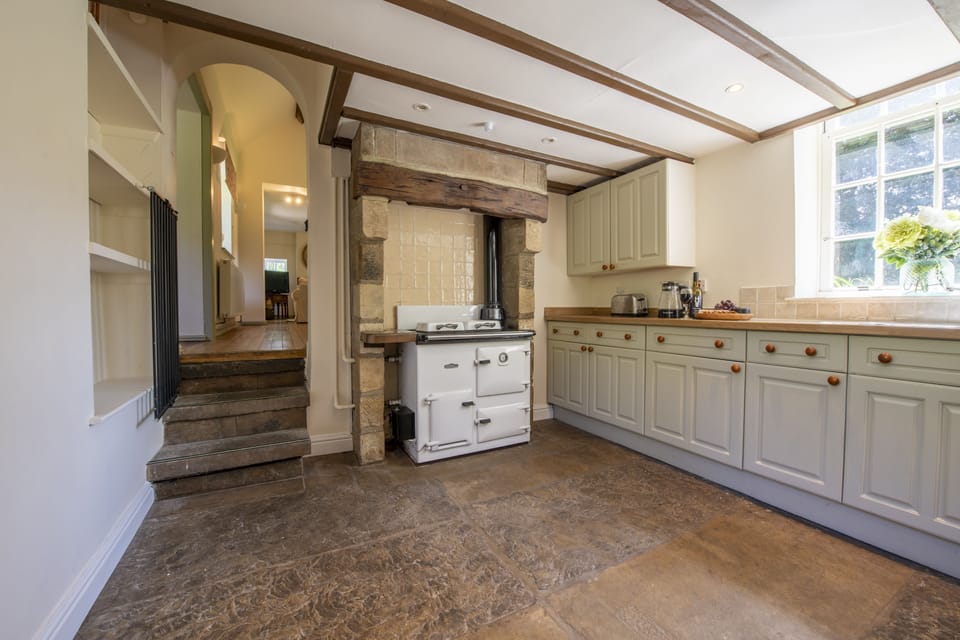 Lower ground floor: Spacious kitchen overlooking the pretty front garden