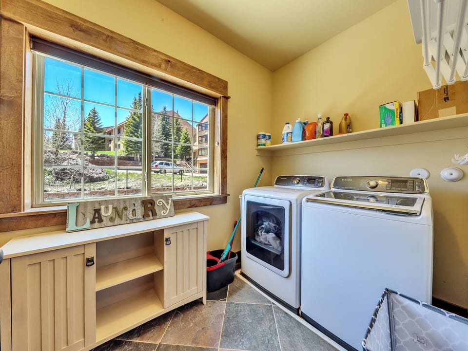 Private laundry room with washer & dryer and ample storage space