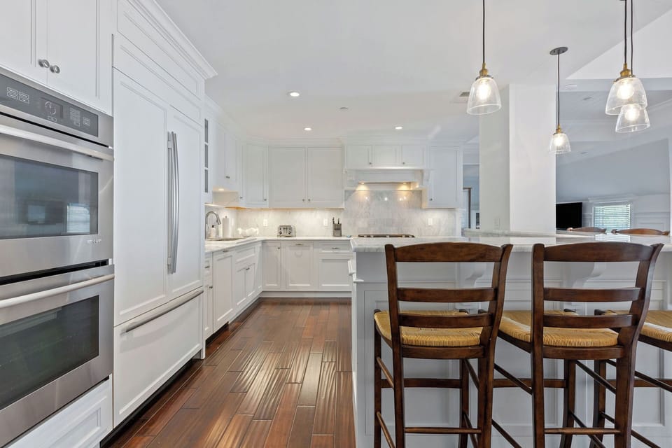 Fully stocked kitchen with granite counter tops. 