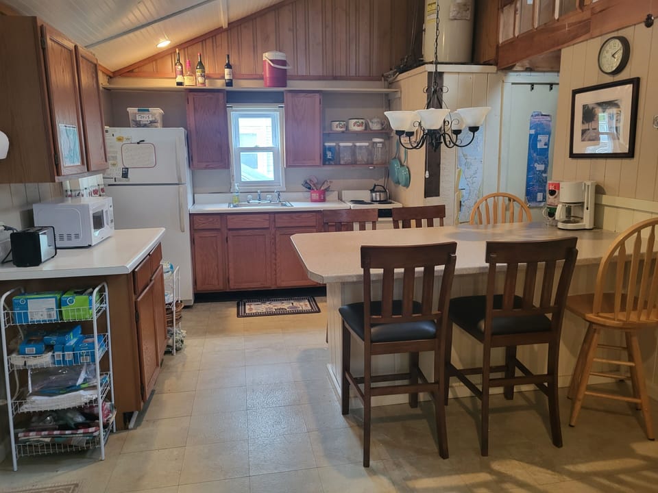 Convenience: microwave, coffeemaker, electric stove. large eating area counter