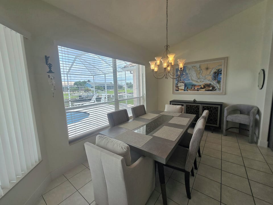 Dining area seats up to 6, offering stunning views of the water, pool, and lanai area!