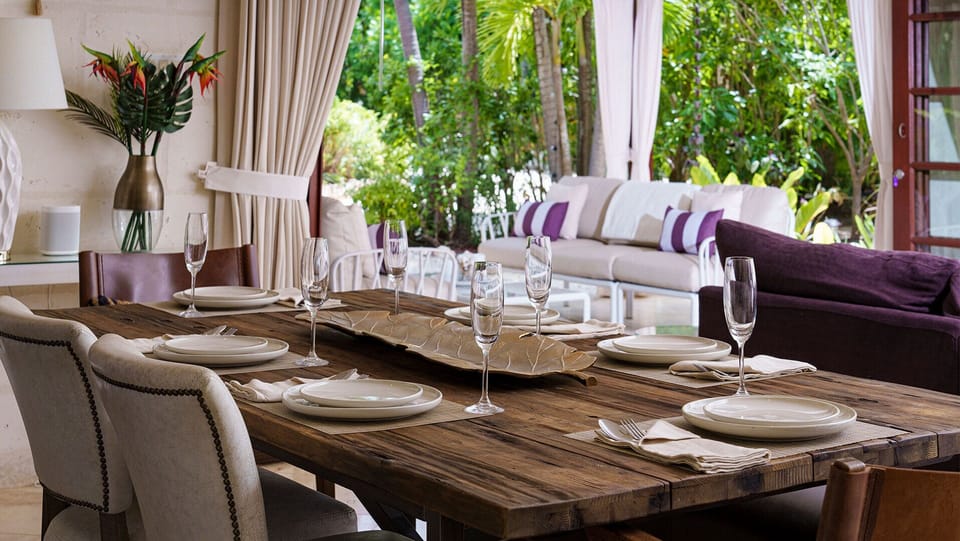 The covered terrace serves as an inviting outdoor