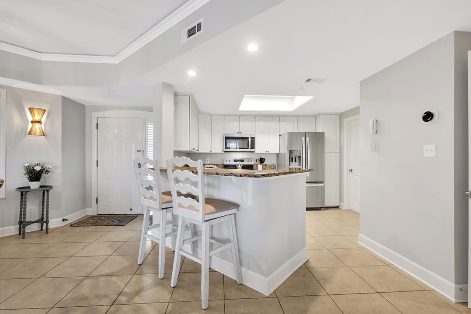 Kitchen and Dining area boasts modern appliances and granite countertops