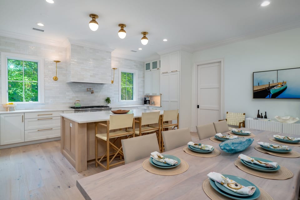 The dining area opens to the gourmet kitchen