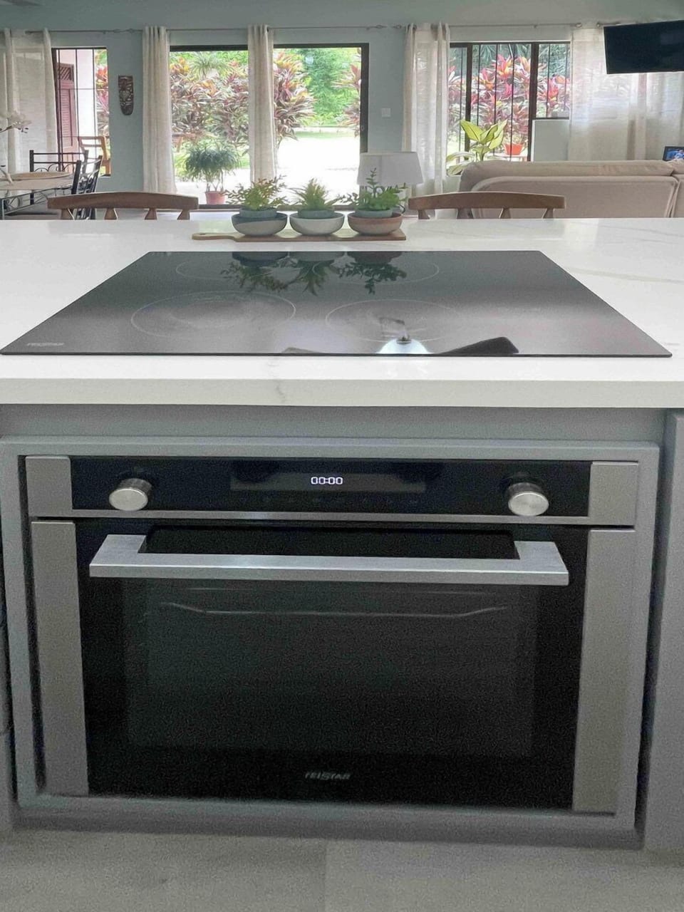 An elegant cooking space with a built-in oven for convenience.