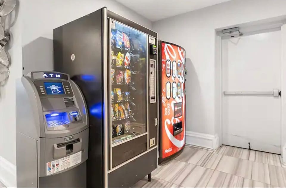 Resident lounge space with vending machines offering convenient snacks.