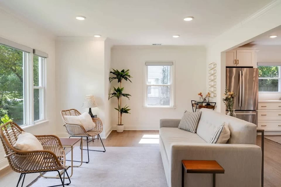 Living Room: A beautifully bright and expansive living room designed for comfort, light, and effortless relaxation.