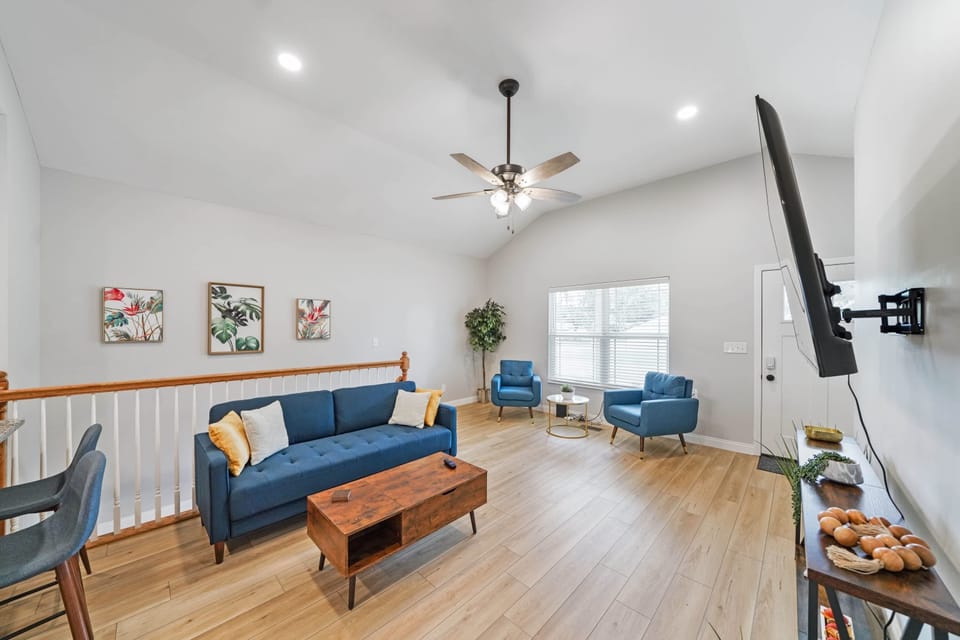 Living Room: A stylish living room with a modern sofa, accent chairs, and tasteful decor, creating a welcoming environment for family and friends.