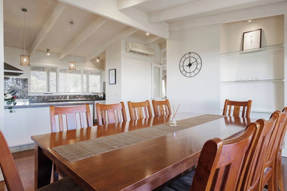 The light-filled dining area includes a 10-seater table setting to share meals.
