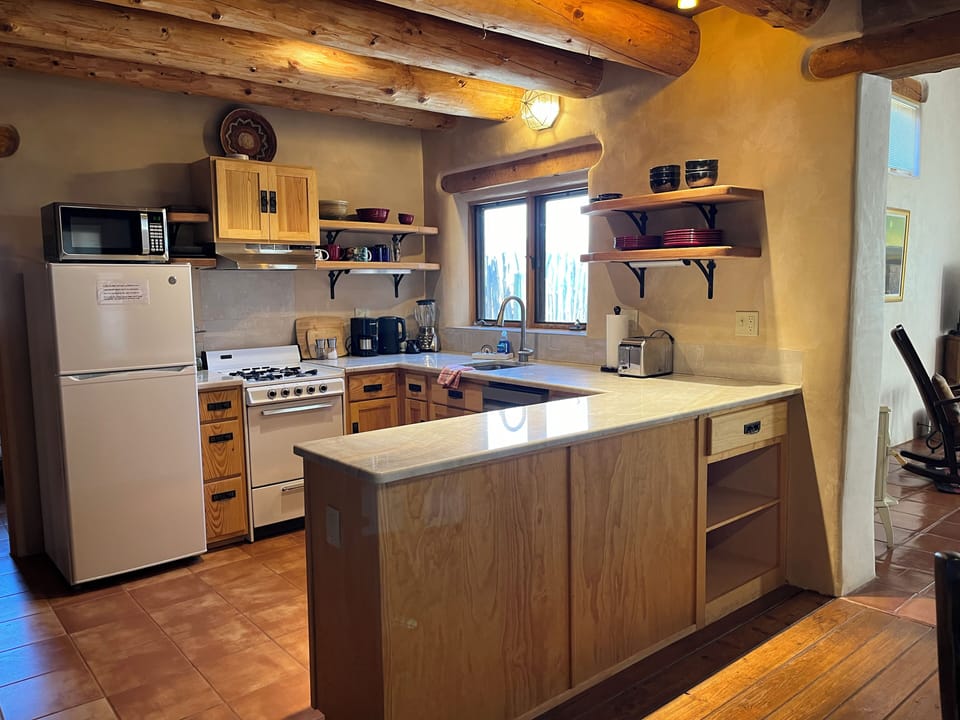 Kitchen with Fridge, range and dishwasher