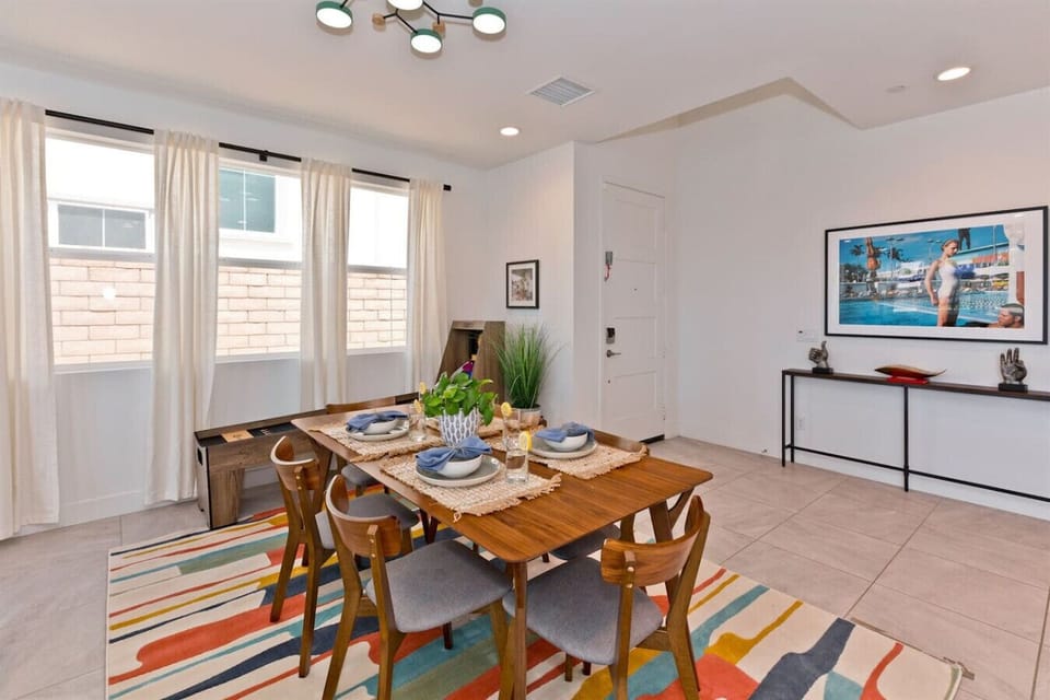 Gather around the stylish table for delightful meals and vibrant conversations!