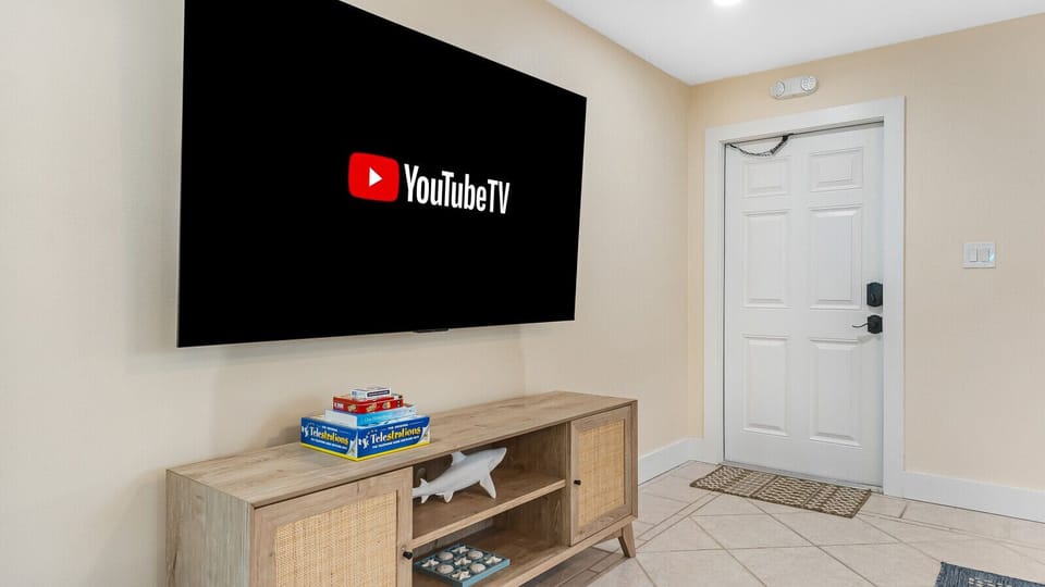 Cocoa Beach Game Nook | Relaxed seaside spot with fun games, shark accents, and safe, easy entry.