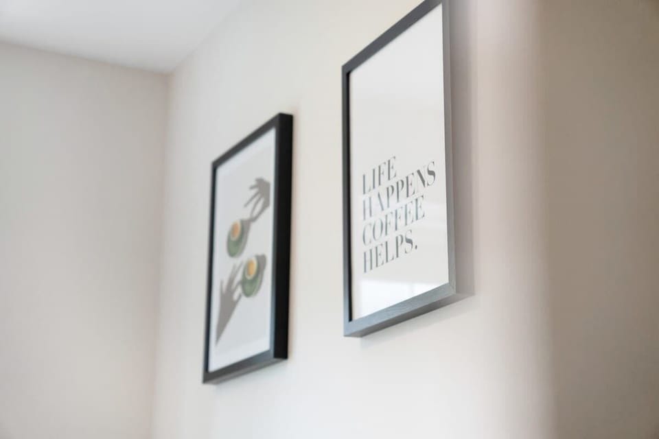 Decorative wall features enhance the space with subtle charm and style, adding visual interest and a homely feel throughout the interior.