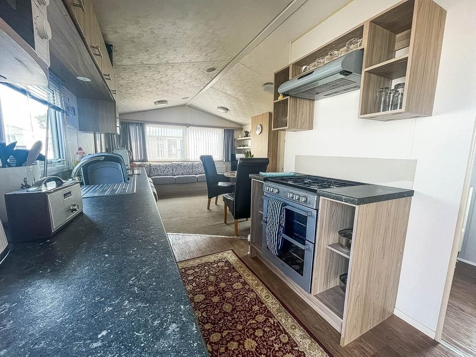 Prepare your favourite holiday meals while being part of the conversation in this convenient open plan caravan kitchen.