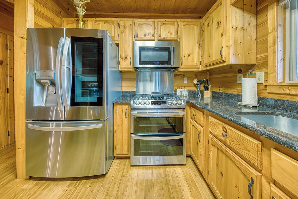 Fully stocked and ready for real meals—not just snacks—this kitchen features brand-new stainless steel appliances, a double oven gas stove, and everything you need to cook, serve, and gather.