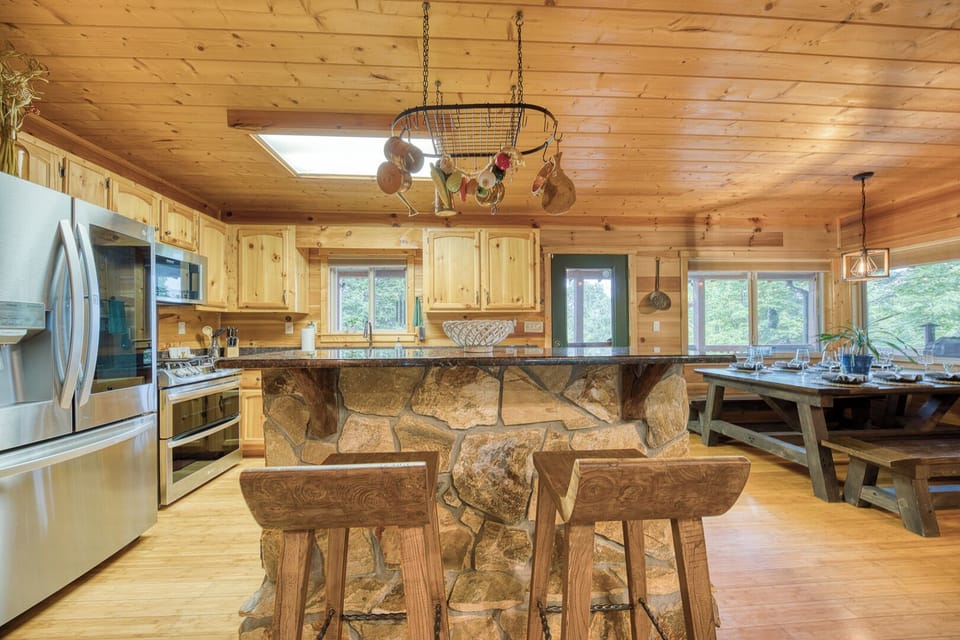 Featuring a gas range, dual convection oven, and modern appliances, this kitchen is designed for both casual mornings and full family dinners.