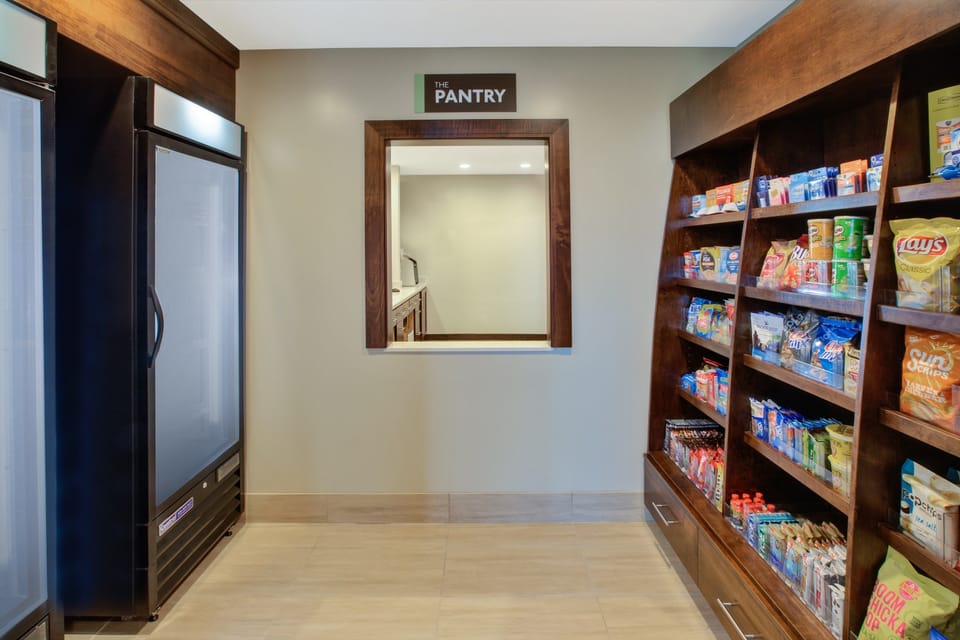 On-site pantry stocked with snacks and beverages for guests.