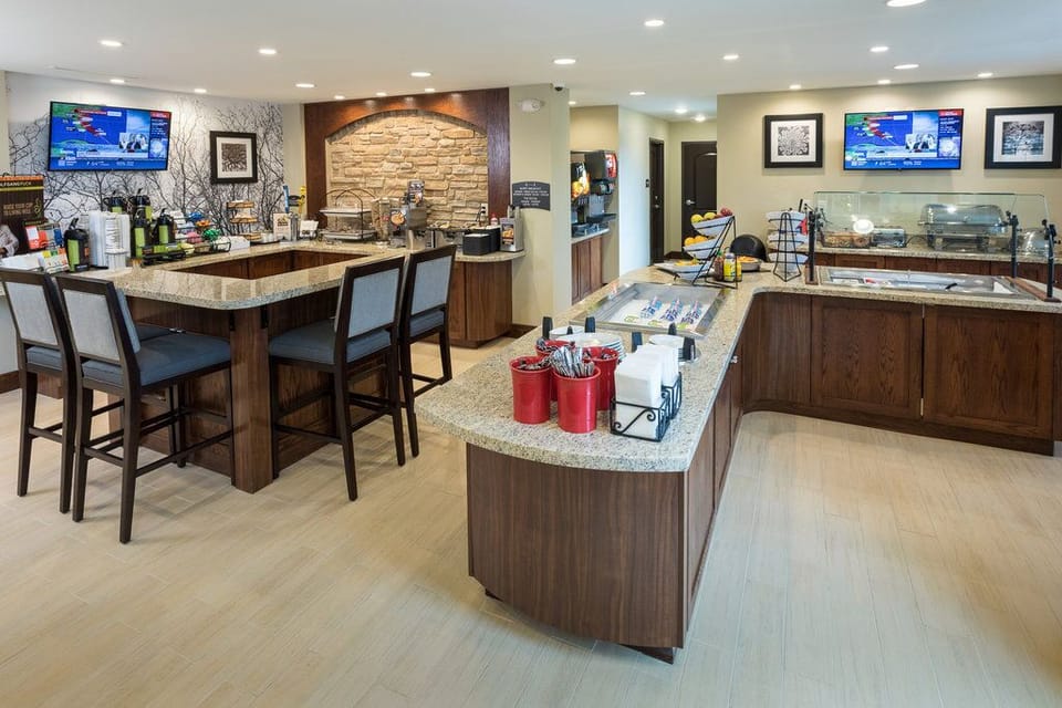 Start your morning right with a delicious breakfast in this inviting and well-equipped dining area.