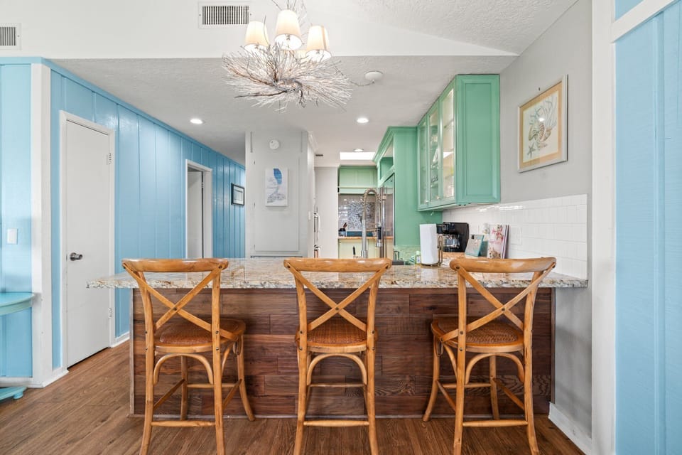 Additional seats at the bar counter in the kitchen.