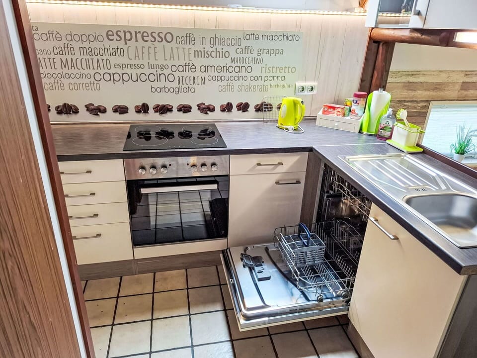 Kitchen Sink, Sink, Tap, Cabinetry, Countertop, Kitchen, Kitchen Stove, Plumbing Fixture, Flooring, Kitchen Appliance