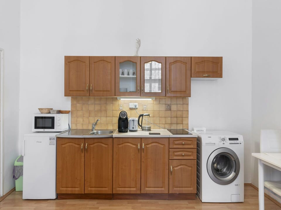 Flooring, Wood, Cabinetry, Major Appliance, Floor, Furniture, Interior Design, Cupboard, Kitchen, Room