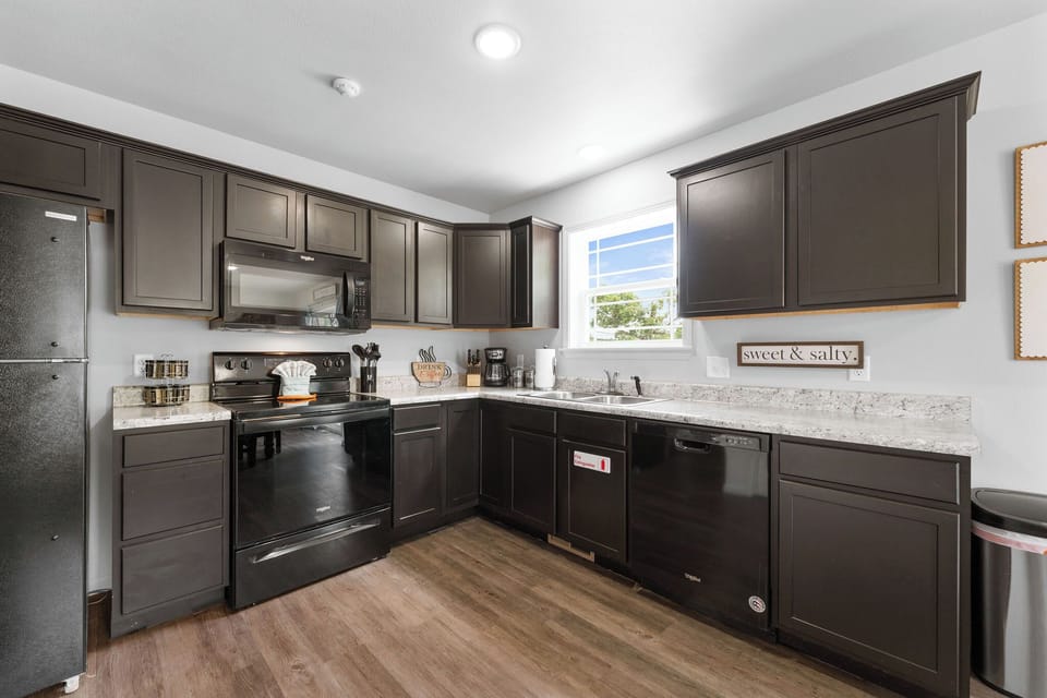 Cabinets are stocked with cooking utensils!