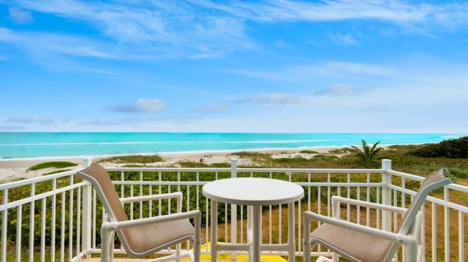 "Enjoy the amazing sunrises while listening to the waves roll in from the master balcony."