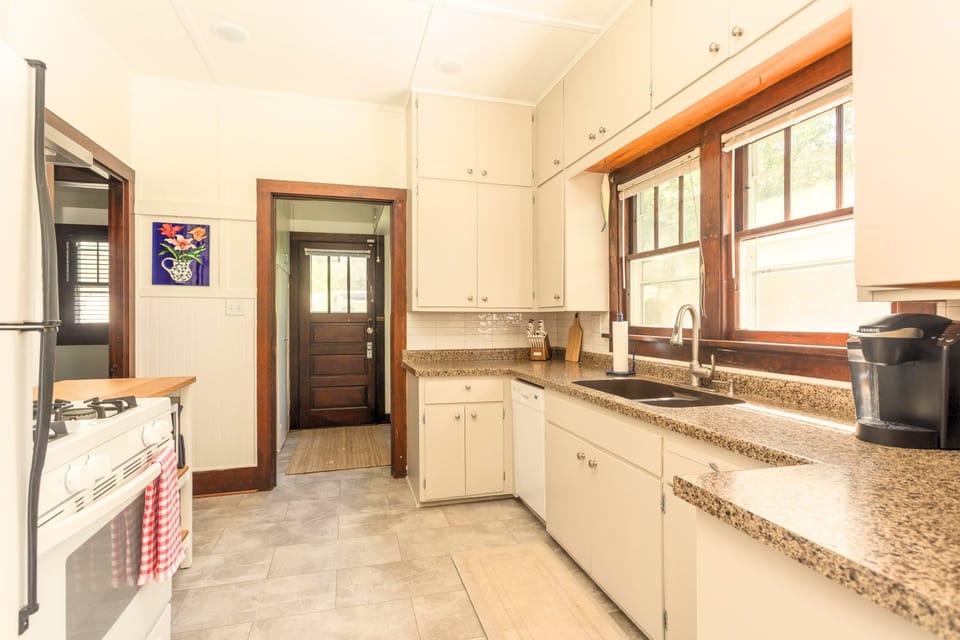 The Main Cottage kitchen with refrigerator, oven, stove, sink, dishwasher and microwave