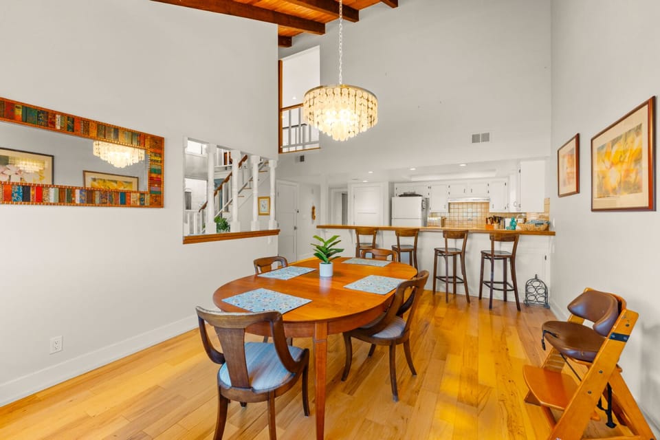 Dining has seating for four  complemented by a stylish kitchen bar with four additional barstool seats.