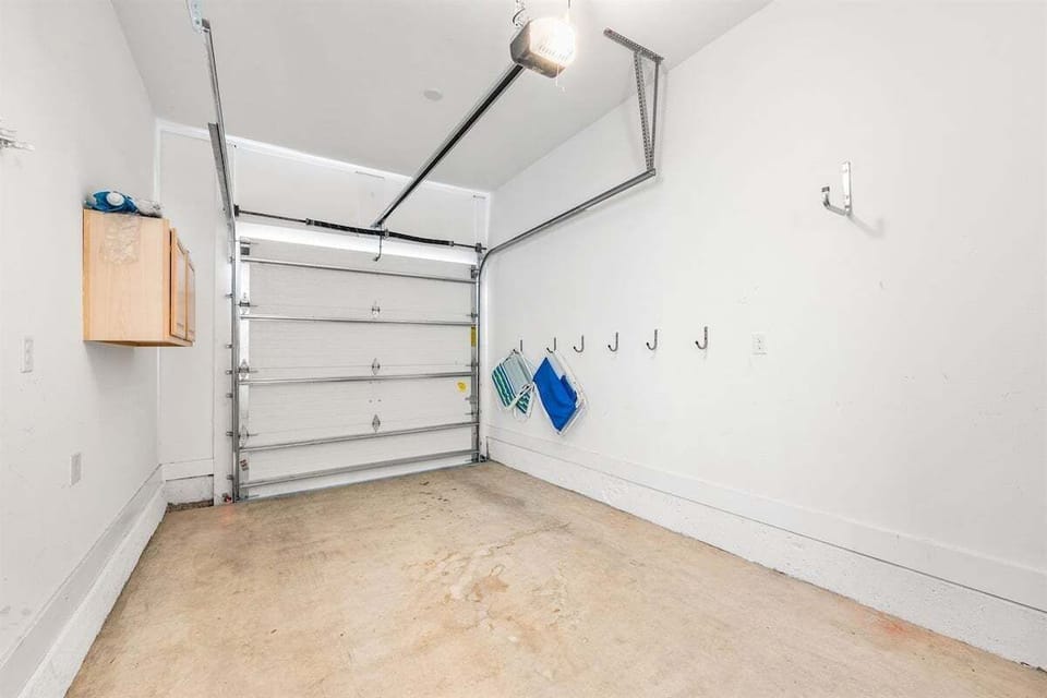 A clean, organized garage space with ample storage for beach gear and more.