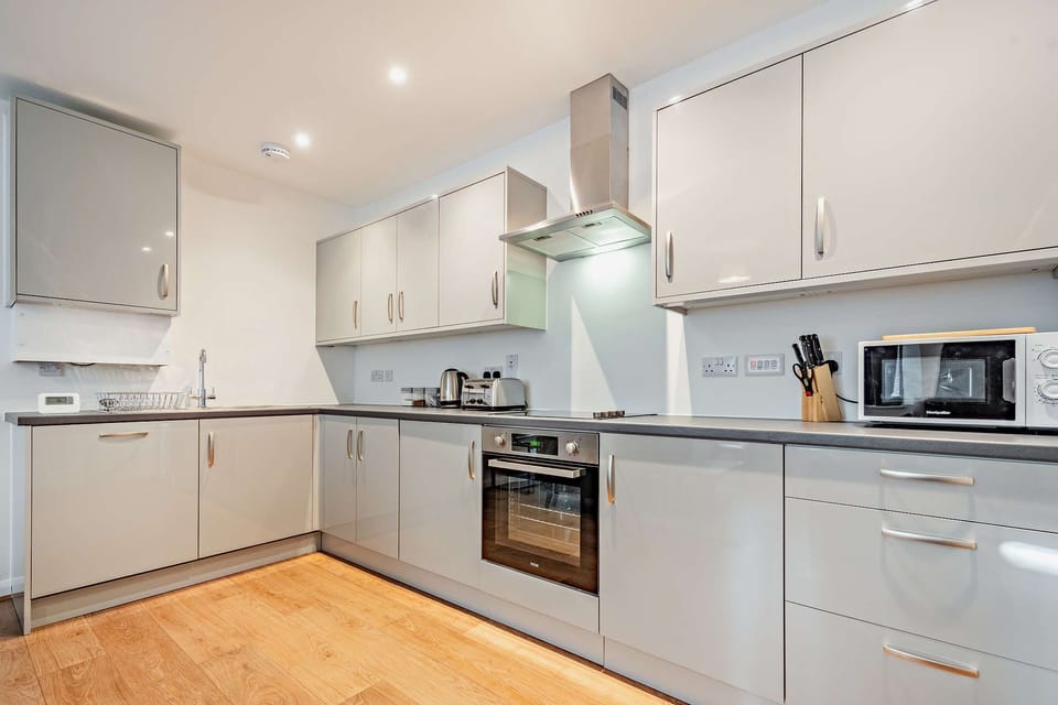 Open plan kitchen/diner/ living room with oven, dishwasher, fridge freezer