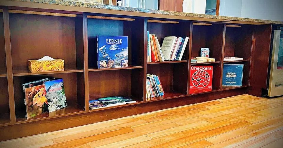Books and games located on the off side of the kitchen island.