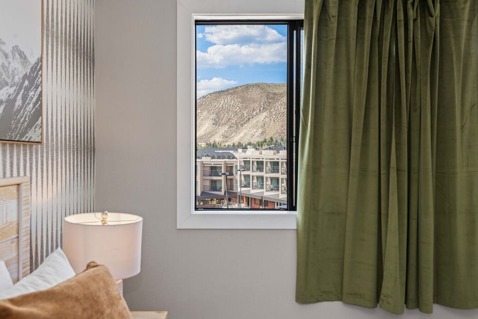Bedroom 1: King bed with smart TV and views