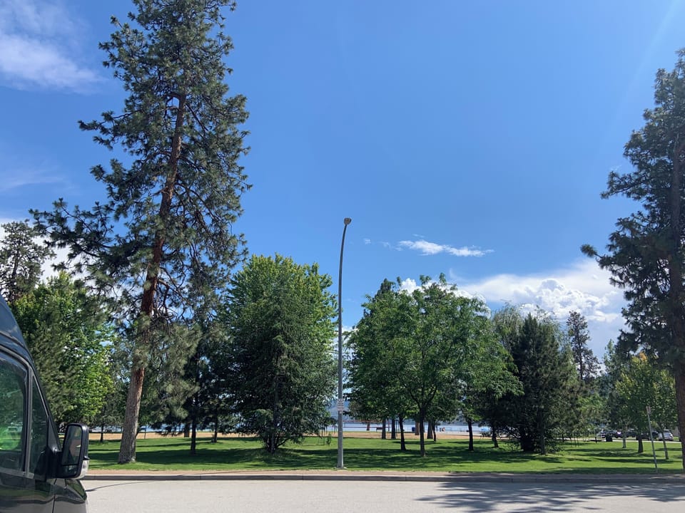 The lush park with beach volleyball courts across the street.