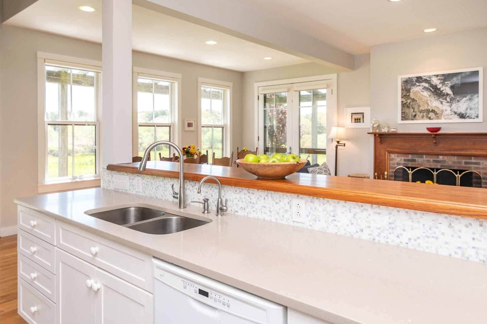 Kitchen Has a Breakfast Bar and Overlooks the Living and Dining Areas
