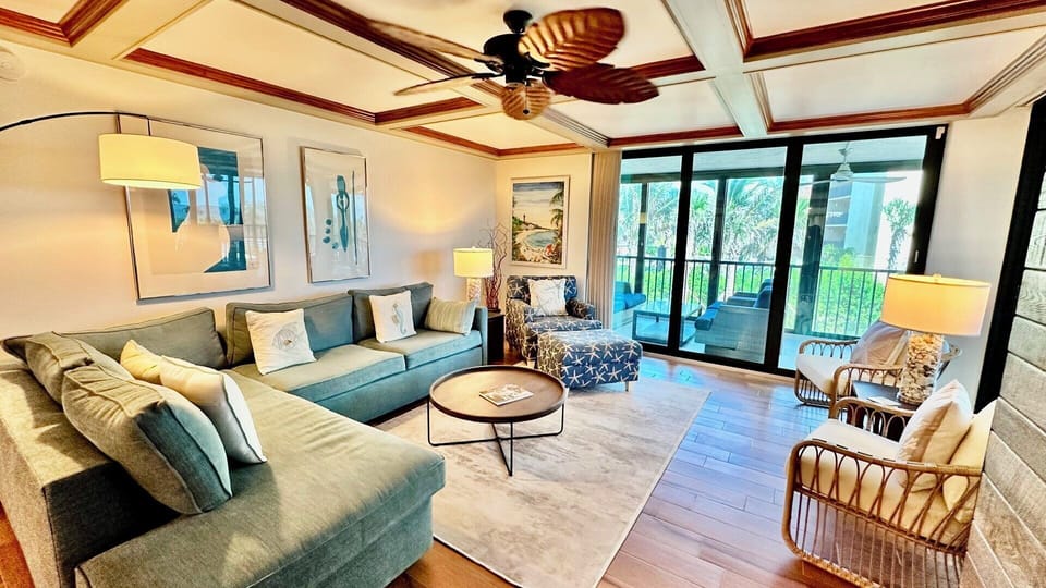Ample seating, lanai access overlooking the pool and gulf.