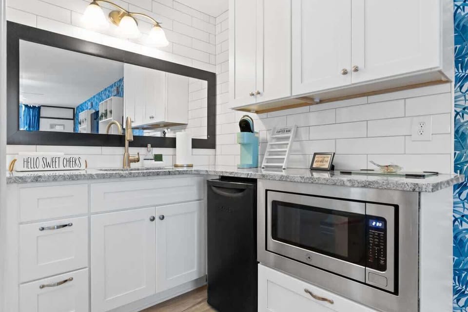 Modern kitchenette perfect for snacks, drinks, and beach-day essentials