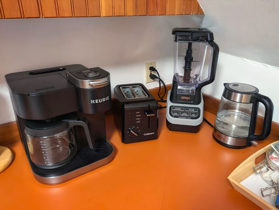 Small space, big convenience! Our modern kitchenette is fully equipped with a microwave, mini-fridge, and all the essential cookware for a quick and easy meal.