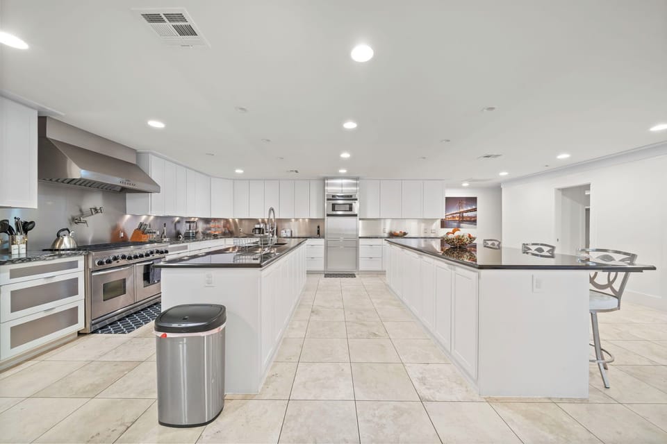Huge commercial kitchen with commercial appliances and 2 large kitchen islands 