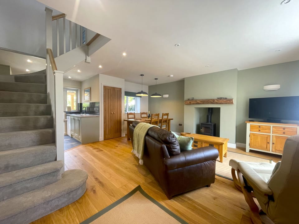 The log burning stove can be enjoyed from both the living and dining areas