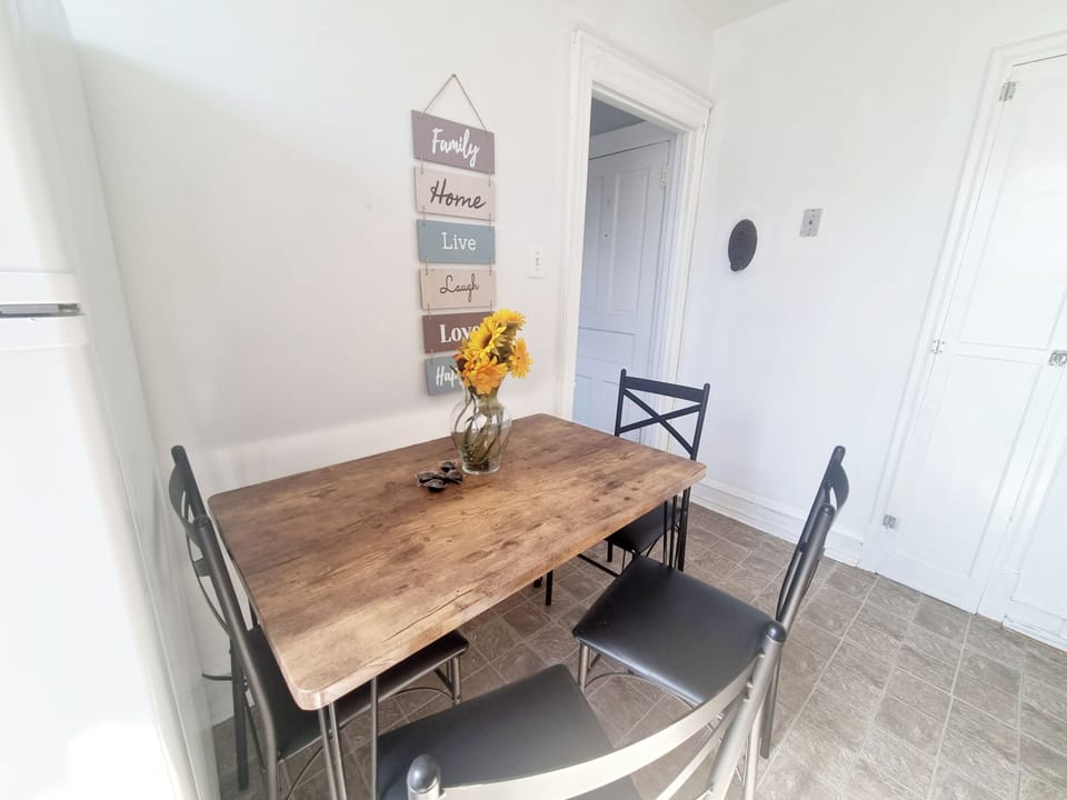 Step into a well-appointed kitchen designed for convenience. It includes a full-sized refrigerator, range, plenty of counter space for meal prep, and dining area. You'll find generous storage in the cabinetry, making it easy to keep things organized.