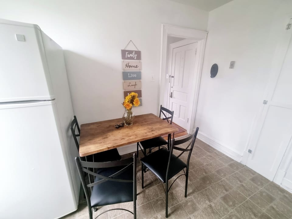 Step into a well-appointed kitchen designed for convenience. It includes a full-sized refrigerator, range, plenty of counter space for meal prep, and dining area. You'll find generous storage in the cabinetry, making it easy to keep things organized.