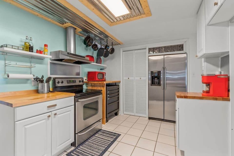 A spacious downstairs kitchen with all the tools and gadgets for family cooking and entertaining