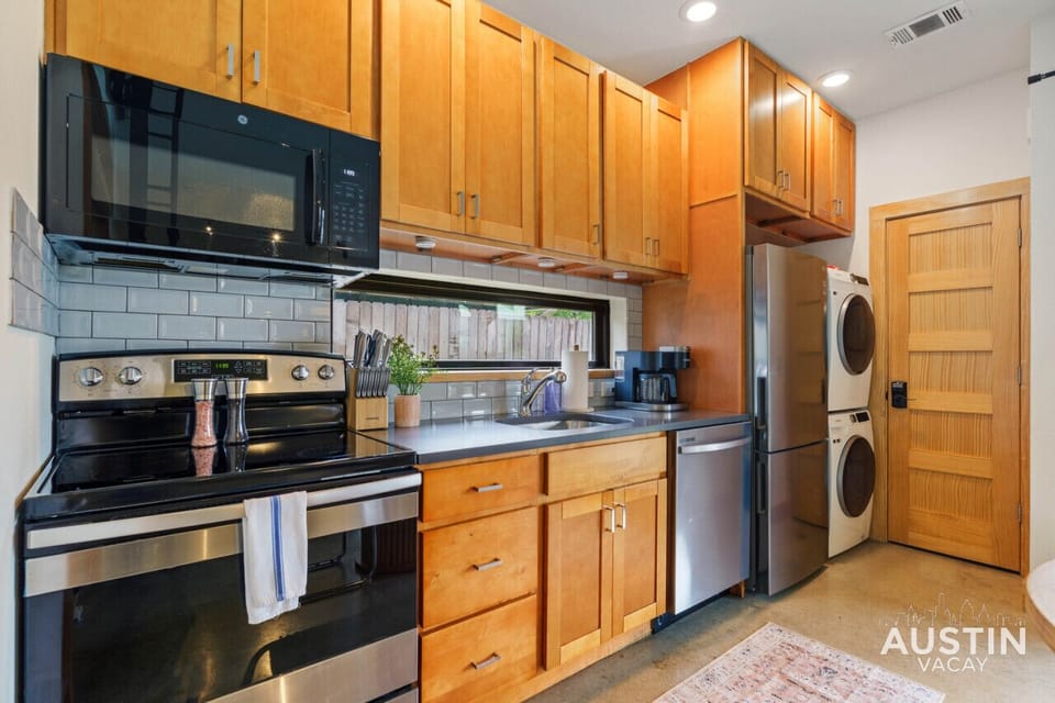 Fully equipped kitchen with all the essentials plus dishwasher, W/D, and dining