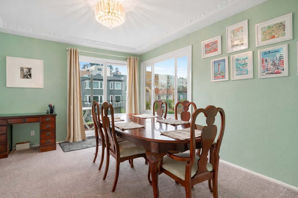 Elegant dining room with classic furnishings, bright windows, and a welcoming space perfect for sharing meals and conversations.