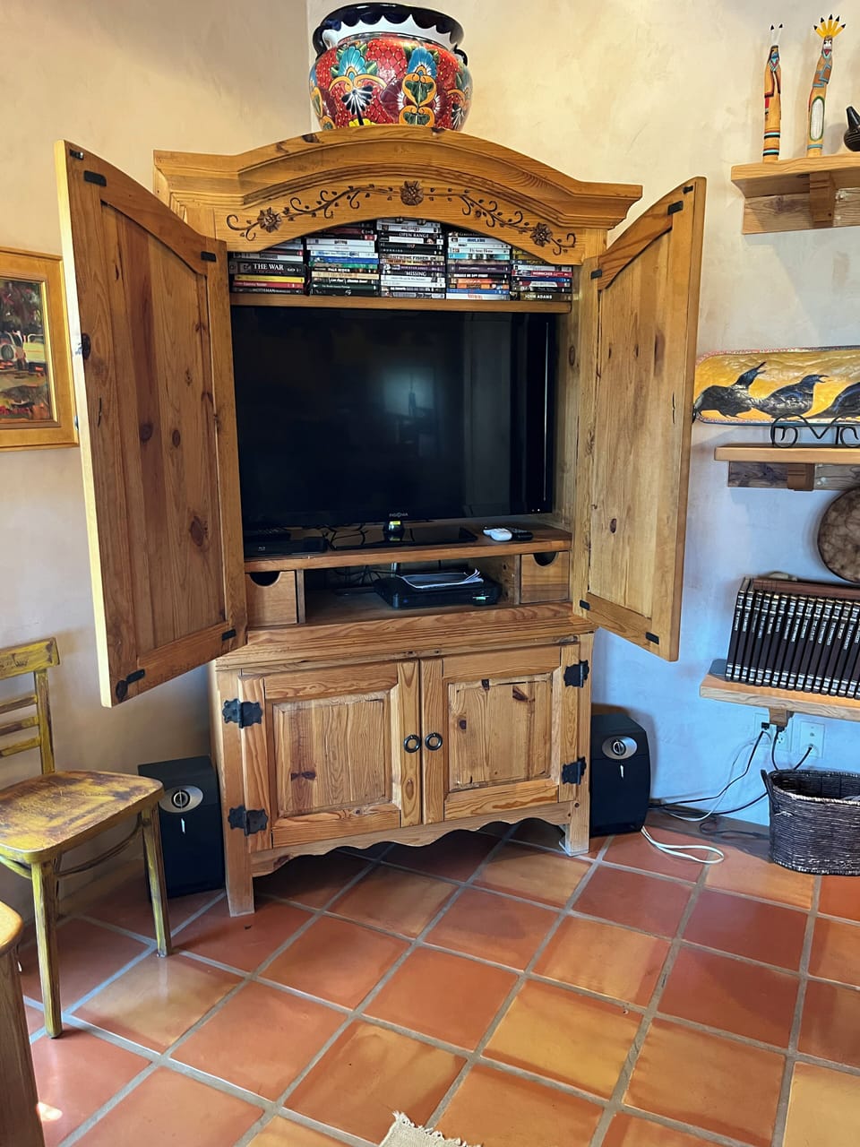 Large Smart TV, with DVD player and collection of titles