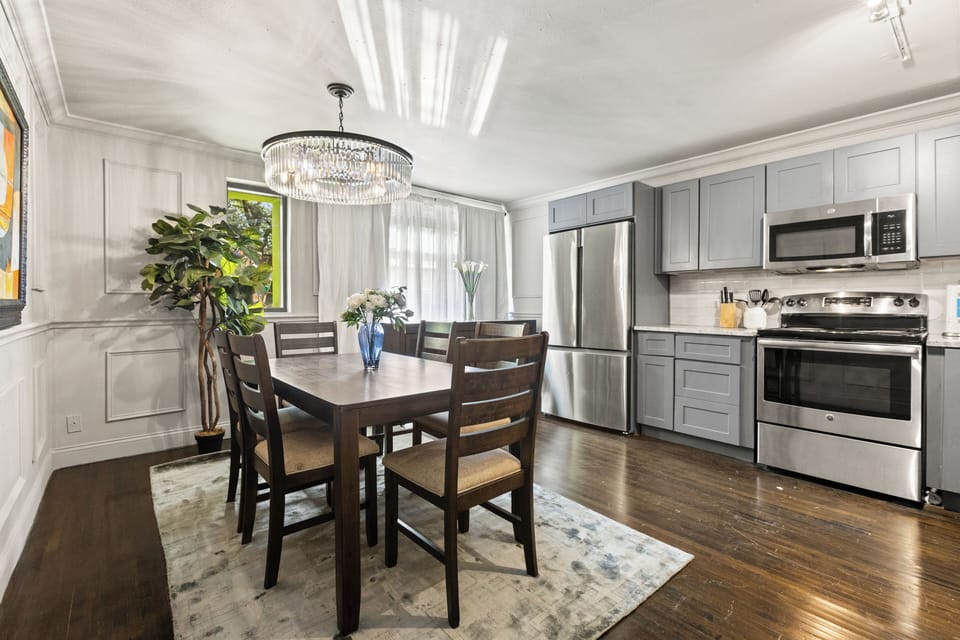 The dining table that’s perfect for both meals and work, complemented by a beautiful chandelier to add a touch of light and elegance when needed.