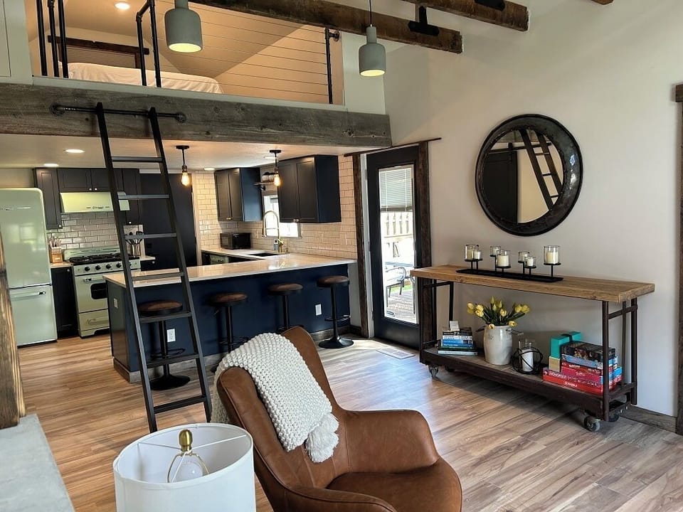 View from living room toward the kitchen and up to the loft.