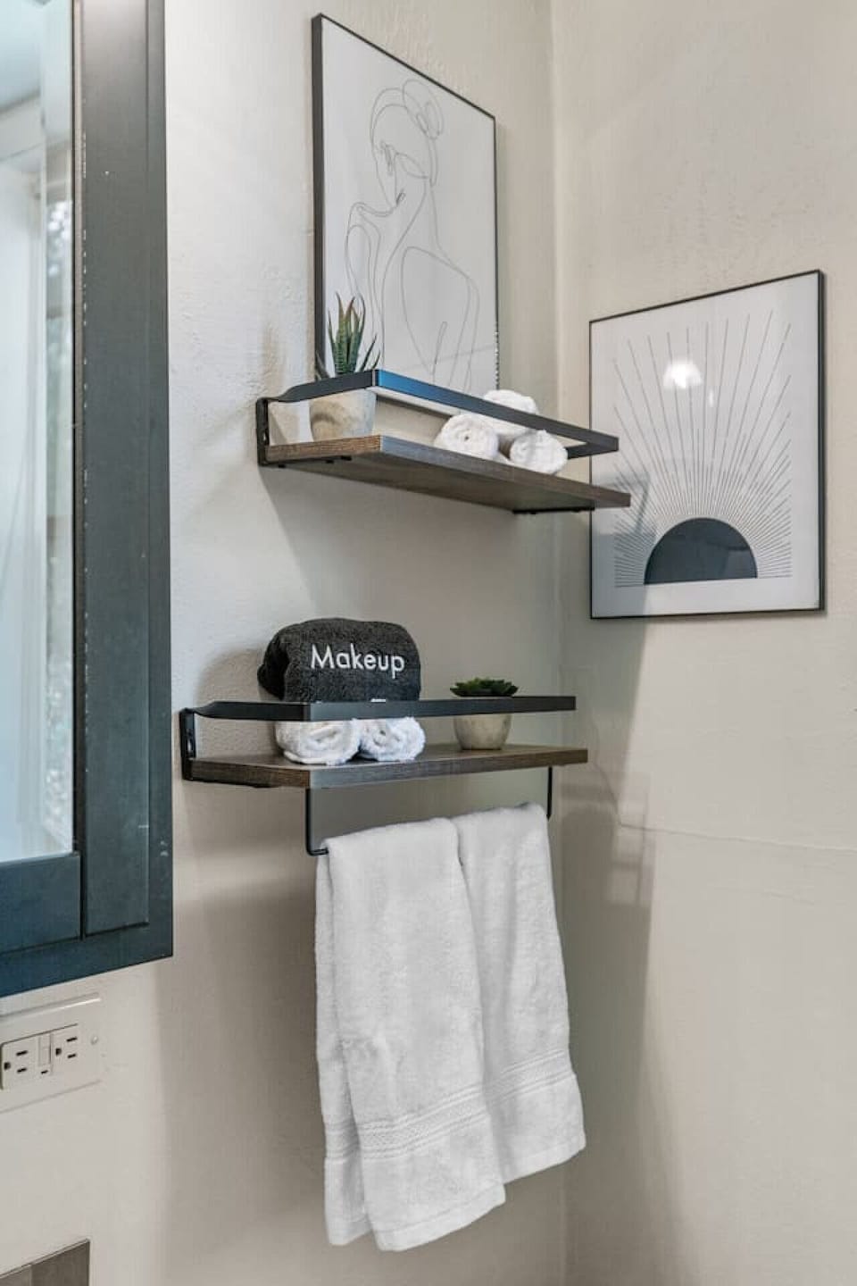 The bathroom is stocked with towels, washcloths and make up towels.